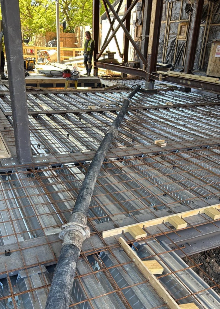 A King Concrete Pumping line pump feeding concrete on site near Bromley